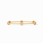 Gold bangle bracelet with four circular stations featuring pave set white stones