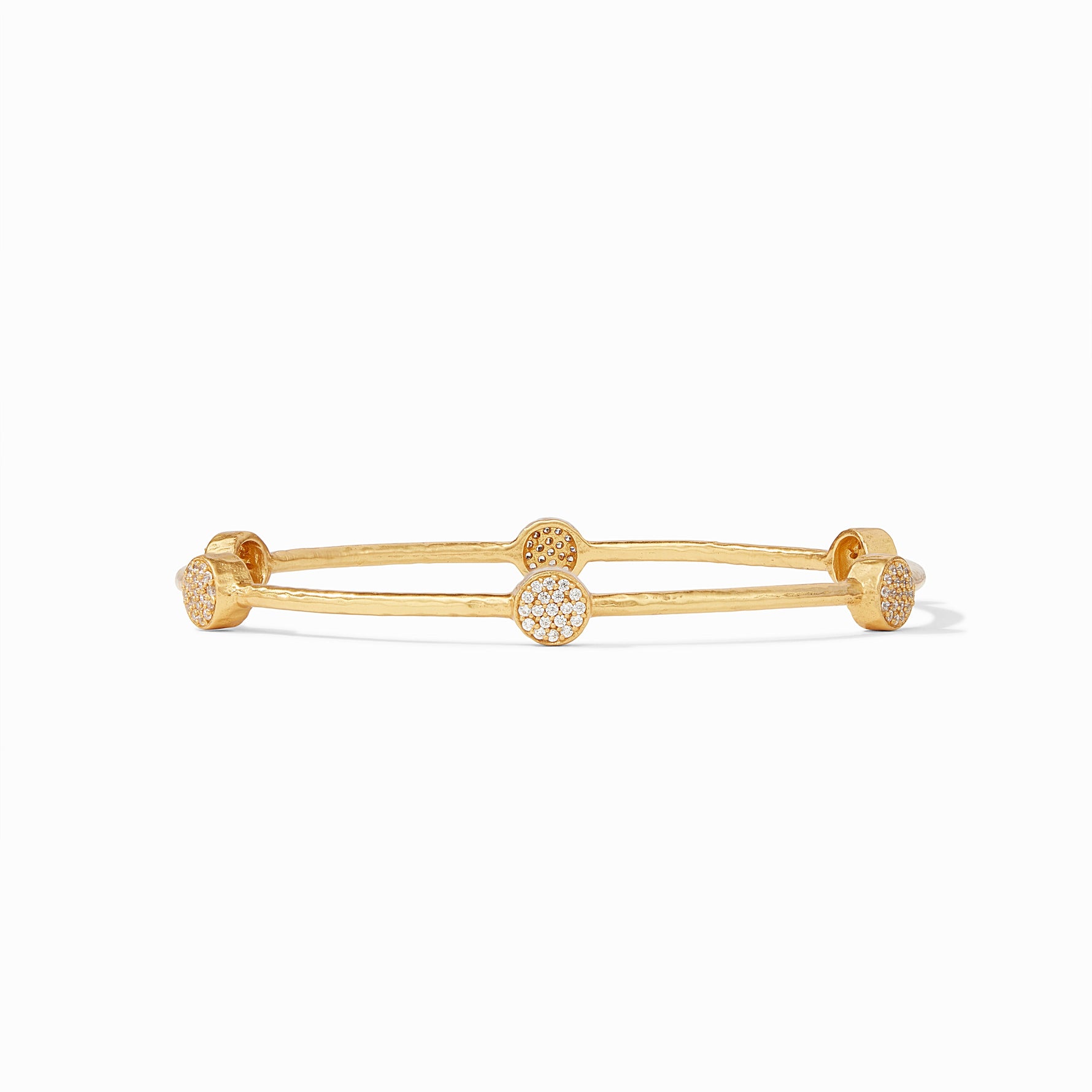 Gold bangle bracelet with four circular stations featuring pave set white stones