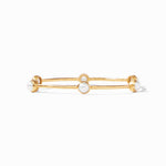 Gold bangle bracelet featuring three evenly spaced white pearls