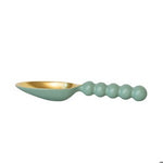 Small spoon with a golden bowl and a light green beaded handle