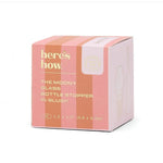 here's how product packaging for The Moony Glass Bottle Stopper in Blush a blush pink box with peach vertical stripes gold lettering and a Modern Mixology brand sticker