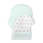 Product photo of a baby teething mitt featuring a mint green silicone top with nubs and ridges, a white fabric base patterned with black and grey triangles, and embroidered 'MUNCH MITT' on the wrist strap