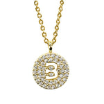 Gold pavé disc necklace with a cutout initial B