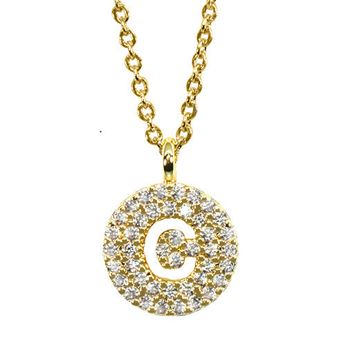 Gold pavé disc necklace with a cutout initial C