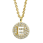 Gold pavé disc necklace with a cutout initial E