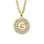 Gold pavé disc necklace with a cutout initial G