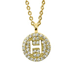Gold pavé disc necklace with a cutout initial H
