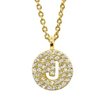 Gold pavé disc necklace with a cutout initial J
