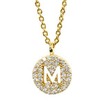 Gold pavé disc necklace with a cutout initial M
