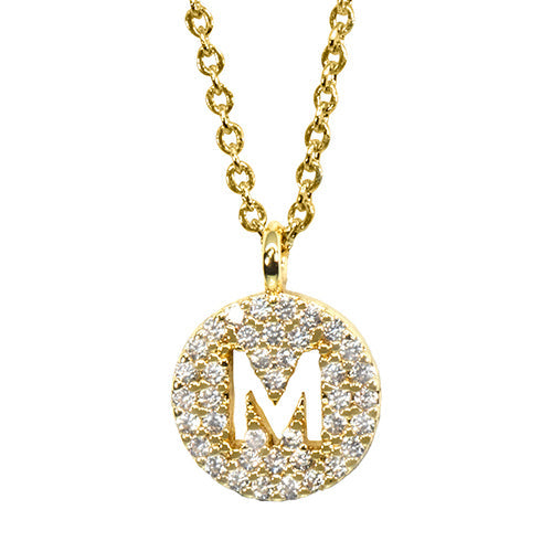 Gold pavé disc necklace with a cutout initial M