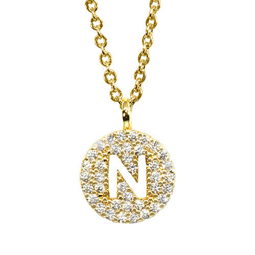Gold pavé disc necklace with a cutout initial N