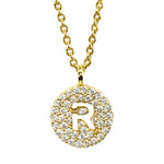Gold pavé disc necklace with a cutout initial R