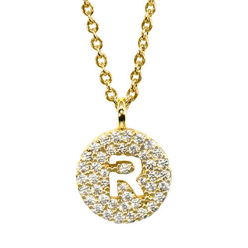 Gold pavé disc necklace with a cutout initial R