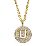 Gold pavé disc necklace with a cutout initial U