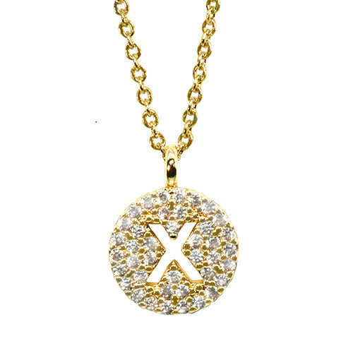 Gold pavé disc necklace with a cutout initial X