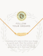 Spartina 449 Daufuskie Island gold necklace featuring a delicate feather pendant, displayed with the "Follow Your Dreams" motto and an inspirational quote, alongside the brand's mermaid logo
