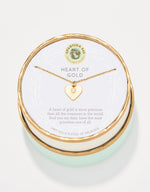 Spartina 449 18kt gold plated necklace from Daufuskie Island featuring a white enamel heart pendant with a central clear gem, presented in a round gold and mint green box with Heart of Gold text
