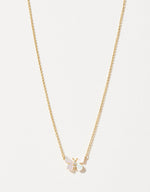 Gold chain necklace featuring a delicate butterfly pendant with iridescent mother-of-pearl wings and a sparkling diamond accent