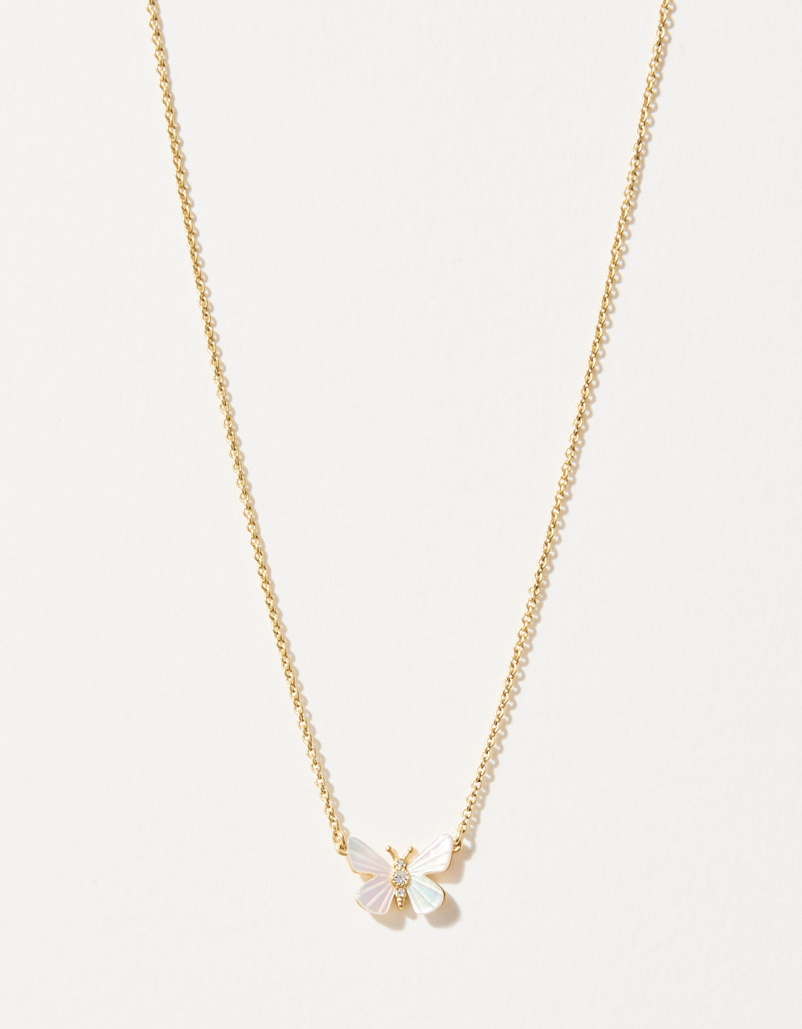 Gold chain necklace featuring a delicate butterfly pendant with iridescent mother-of-pearl wings and a sparkling diamond accent