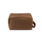 Product photograph of a rectangular deep brown toiletry bag made of smooth structured material, featuring a top zipper with two pulls and a fabric loop handle on the side