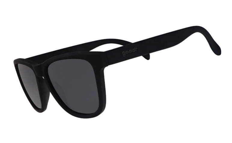 Digital photograph of Goodr matte black sunglasses with dark grey lenses and the goodr logo on the right temple