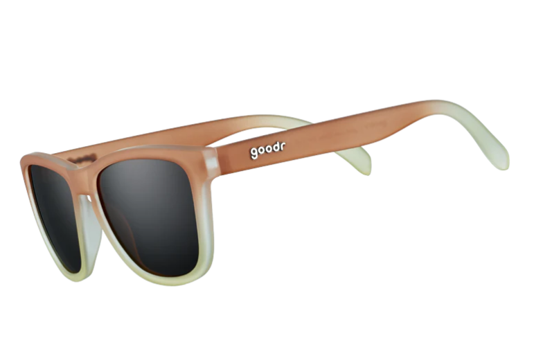 goodr sunglasses featuring a frosted rectangular frame that gradients from tan to light green with dark lenses
