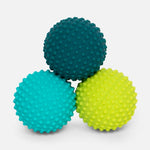 Three textured sensory balls in teal blue and lime green
