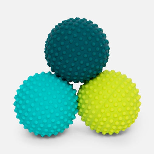 Three textured sensory balls in teal blue and lime green