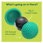 Exploded view of a textured teal massage ball showing a black spherical magnet inside