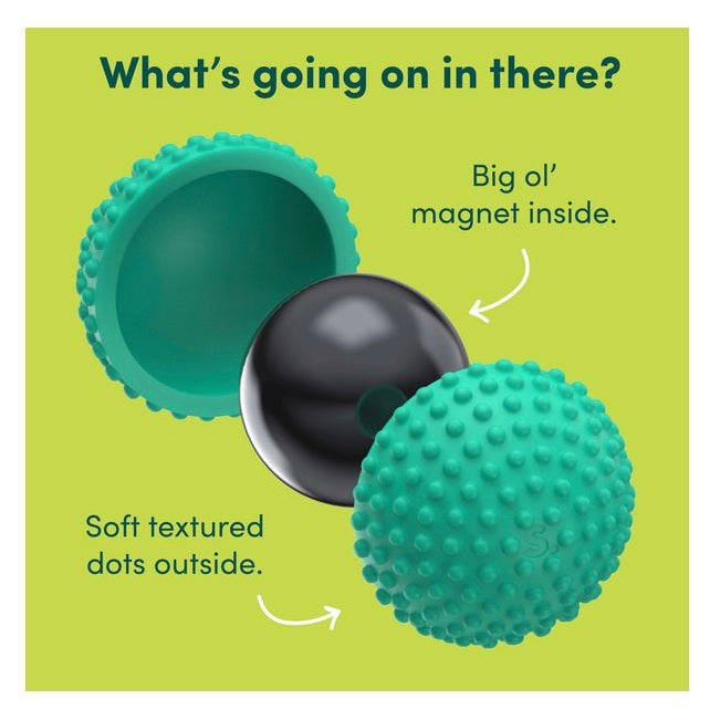 Exploded view of a textured teal massage ball showing a black spherical magnet inside