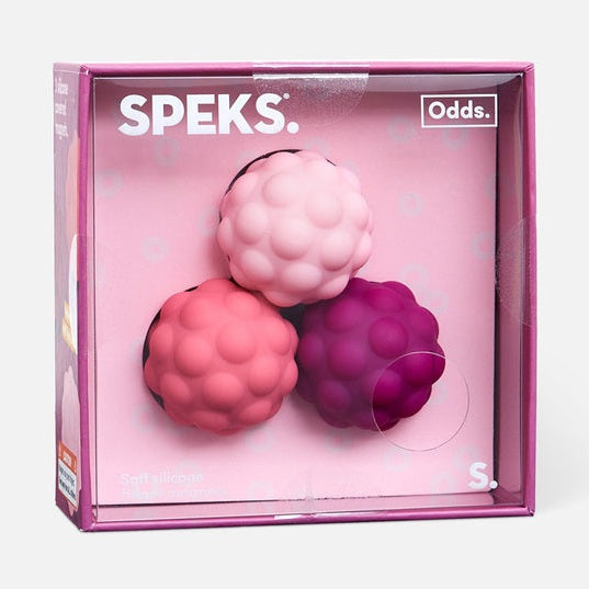 Three textured silicone spheres in pink and purple shades inside a square retail box