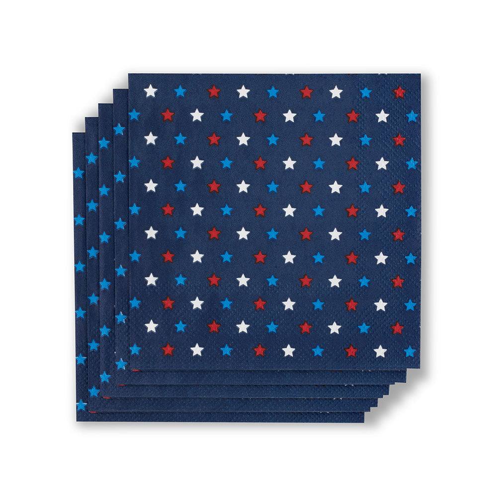 Paper napkins featuring a stack of navy blue square party supplies with a repeating pattern of small red, white, and blue stars showing a textured paper finish against a clean white background