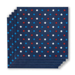 Paper napkins featuring a dark blue background with a repeating pattern of red, white, and blue stars neatly stacked