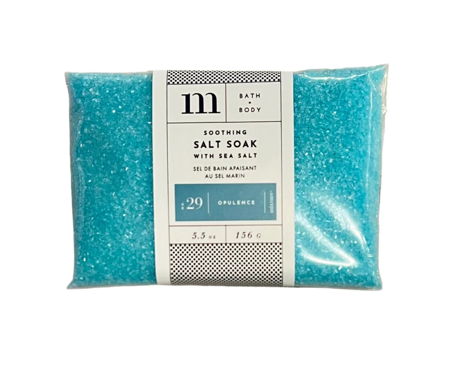 Blue bath salt soak in a clear plastic pouch with a white product label