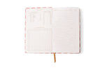 Open notebook on a white background with a colorful abstract patterned cover and gold ribbon bookmark, featuring a left page with kitchen equivalents and a multiplication table, and a right page with ruled lines and 'Subject Date' headers