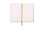 An open journal featuring lined pages with "SUBJECT" and "DATE" headers, a textured orange ribbon bookmark, and a vibrant pink and orange geometric pattern on its edges