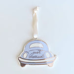 Ceramic ornament of a light blue vintage car with white bumpers and rose gold "just married" script hanging from a white ribbon
