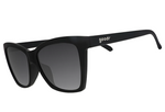 Product photo of Goodr matte black sunglasses featuring dark gradient lenses and the white Goodr logo on the temple
