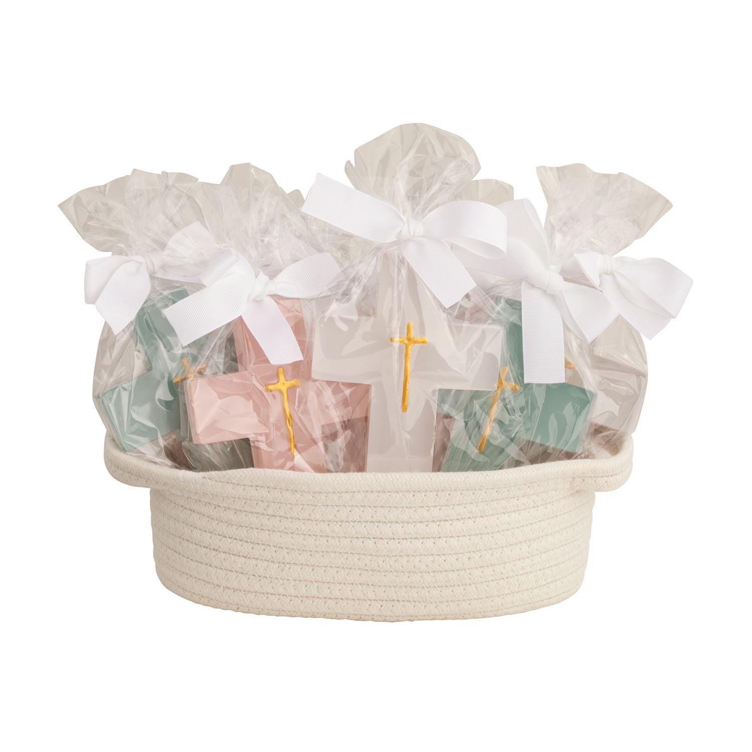 Photograph of a cream woven rope gift basket filled with individually wrapped favors in clear cellophane tied with white bows and featuring gold crosses on light pink, teal, and white items