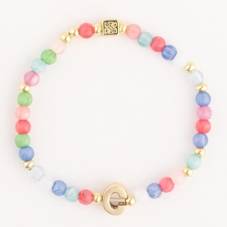 Beaded bracelet featuring a vibrant array of pastel-colored glass beads alternating with gold-toned spacers, a square patterned gold charm, and a distinctive G-shaped gold clasp