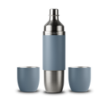 Product photography of a Parkside Flask brand stainless steel and matte dusty blue beverage set on a black background showing a tall flask flanked by two matching tumblers with steel rims