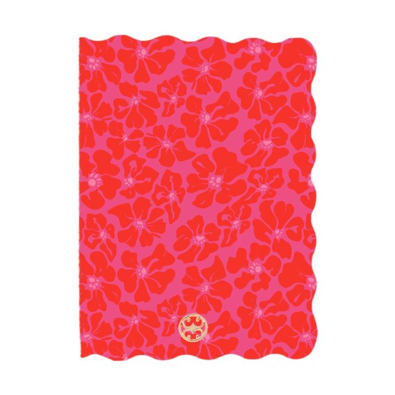 A patterned notebook cover displaying vibrant red abstract flowers on a bright pink background, featuring a distinctive scalloped edge and a small gold circular logo