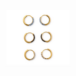 Six gold hoop earrings displayed in three pairs, each featuring pavé-set crystal designs in light blue, black, and clear stones