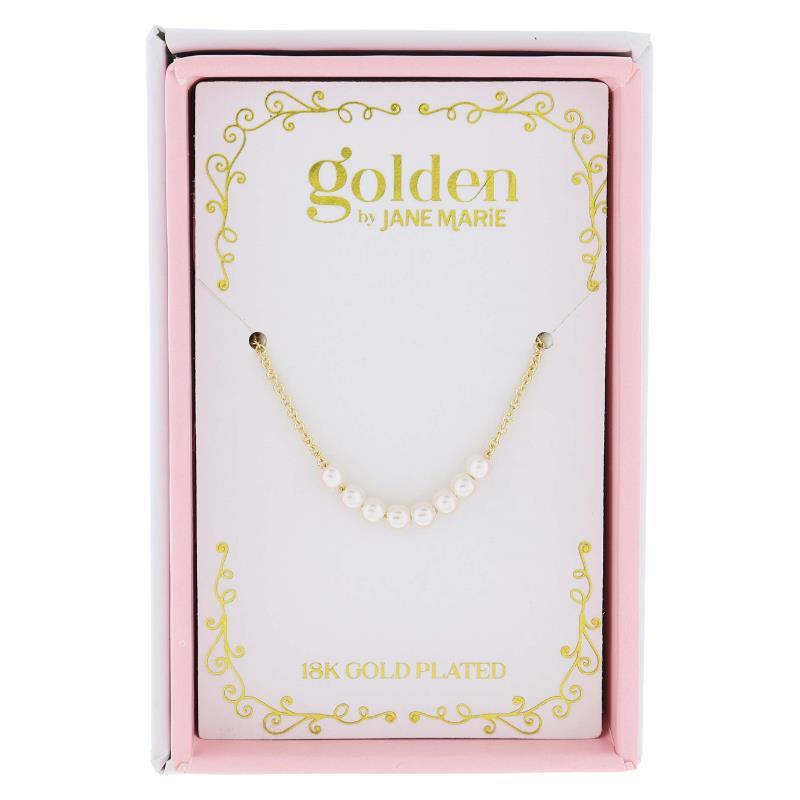 Product photo by Golden by Jane Marie of an 18K gold plated necklace with a row of white pearls, displayed in a pink and white box featuring gold scrollwork and '18K GOLD PLATED' text