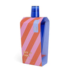 Product photo by Here's How showcasing a blue glass Penelope Riviera Cocktail Shaker with a matching blue cup lid inside a vivid pink and orange diagonally striped box on a white background
