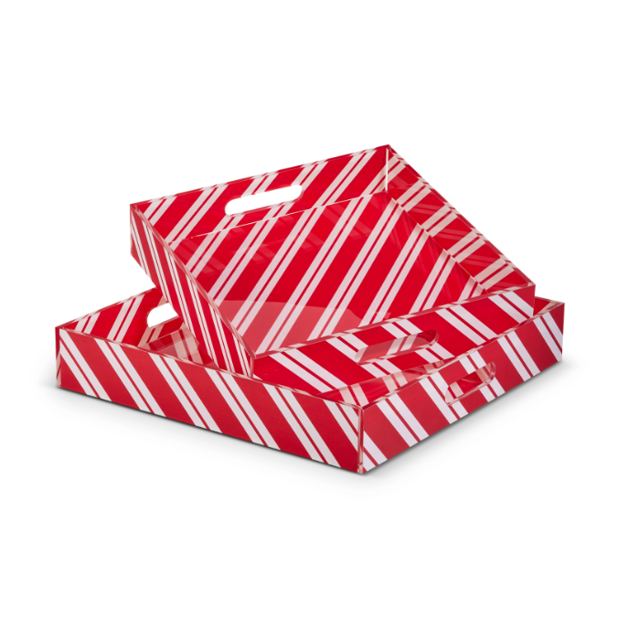 Two nested red and white candy cane striped rectangular serving trays made of glossy material with integrated handles
