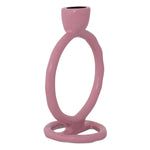 Glossy ceramic sculptural dusty rose candlestick featuring an elongated figure-eight loop and black interior opening