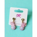 Pink resin bunny earrings with rhinestone studs on a white display card