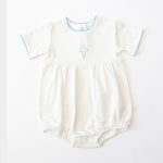 White baby romper featuring a light blue embroidered cross, delicate blue scalloped trim on the round neckline and short sleeve cuffs, and snap closures at the bottom
