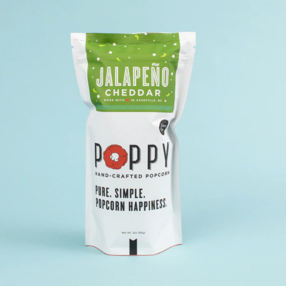 Poppy Hand-Crafted Jalapeño Cheddar popcorn in a white pouch featuring a green top band, a vibrant red poppy logo, and Made in Asheville NC text